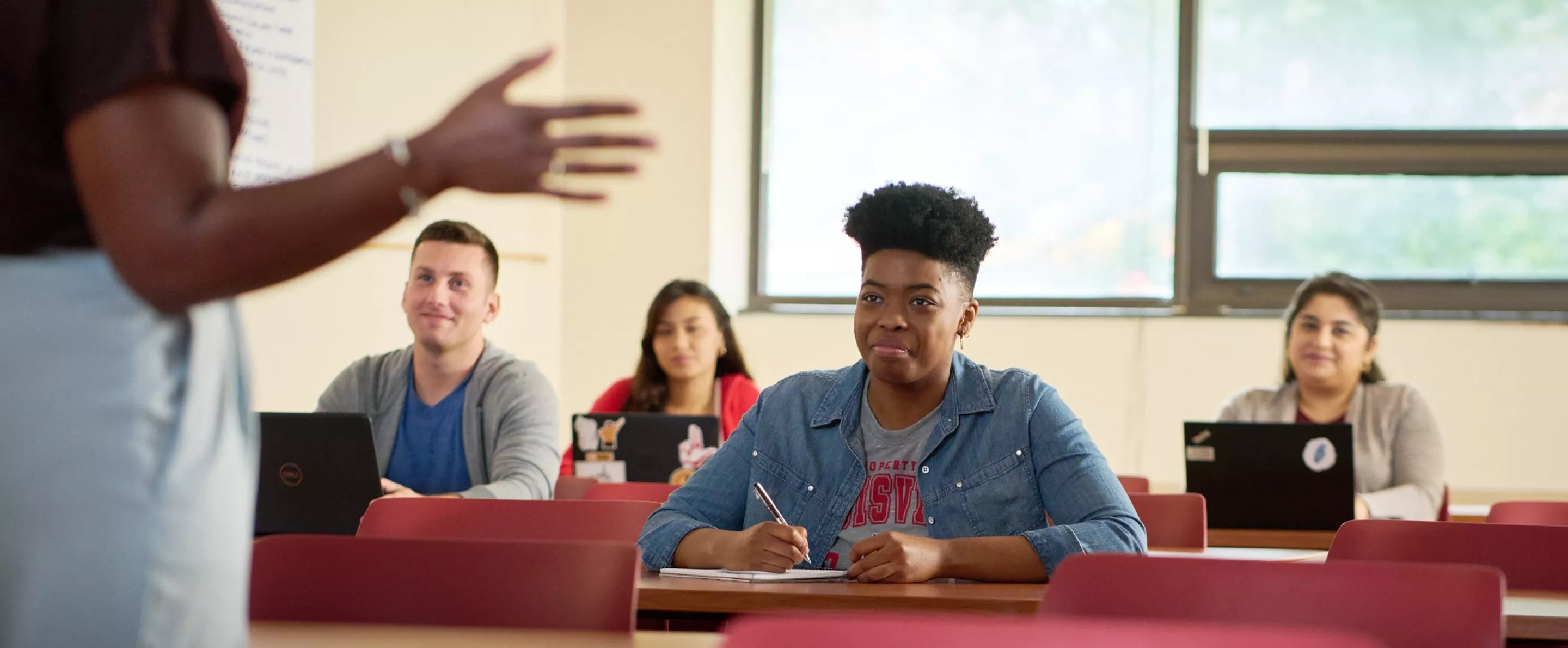 Female professor teaches her class.