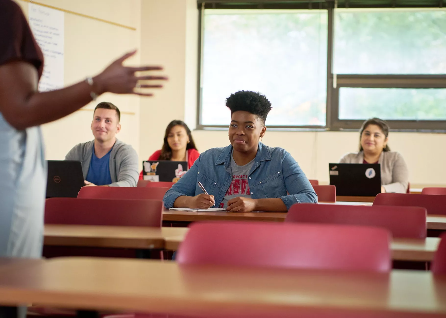 Female professor teaches her class.