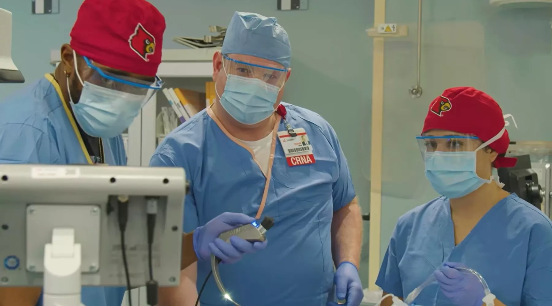 Dr. Zohn Centimole providing instruction to two Nurse Anesthesia residents in a simulation setting.