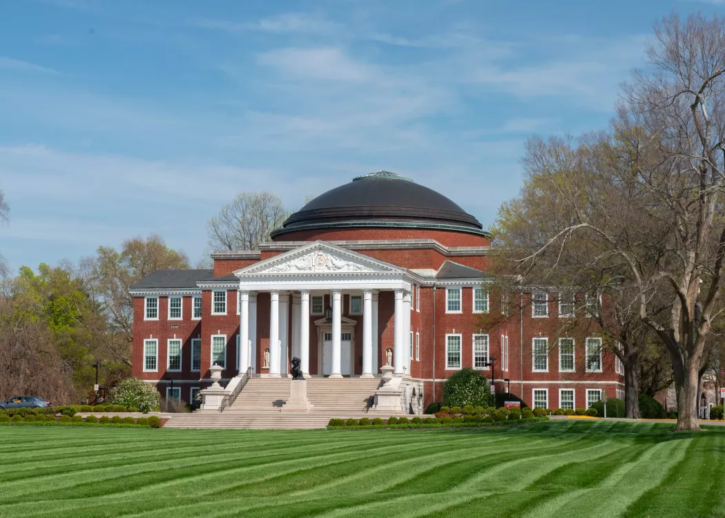 Exterior of Grawemeyer Hall and the lawn within the Oval on a bright spring day.