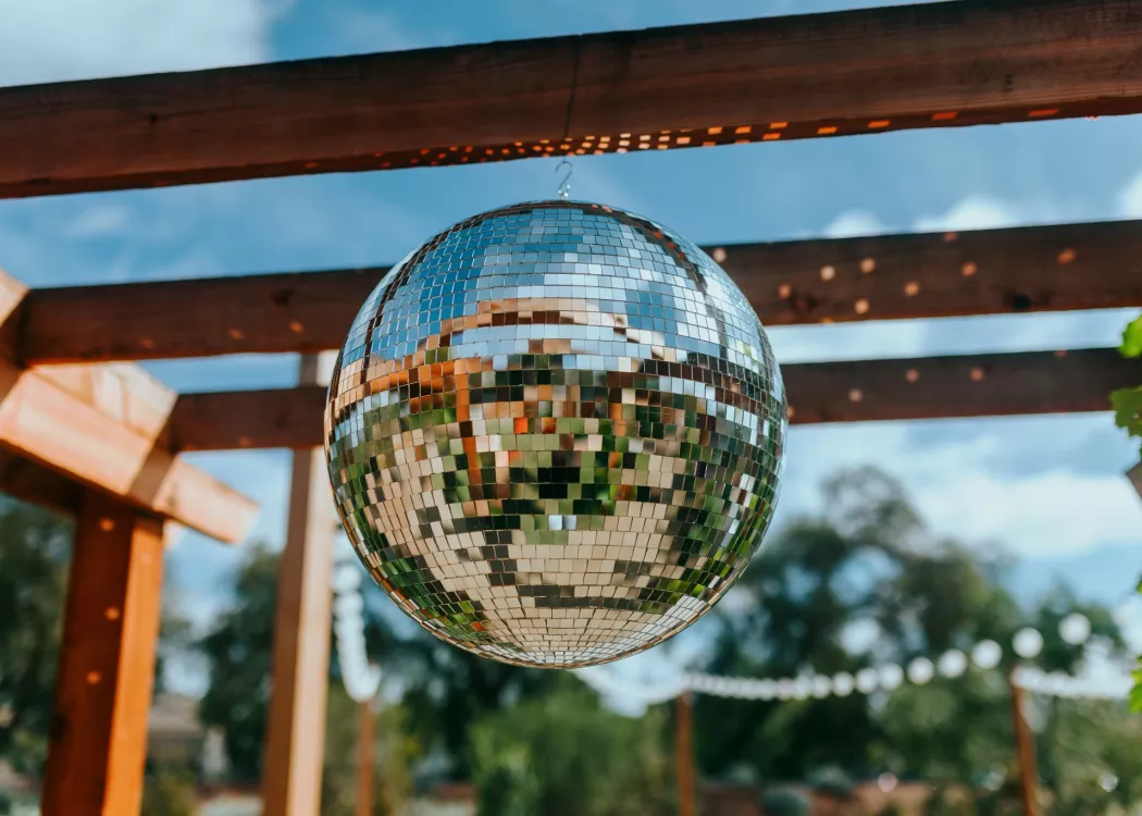 photo depicting a disco ball hung up outside