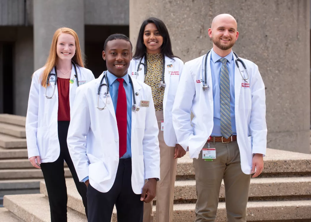 A group of medical students standing in the quad of the HSC.