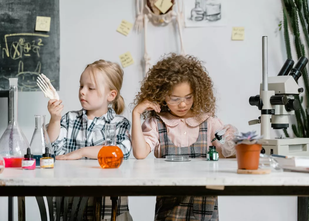 Two girls exploring science.