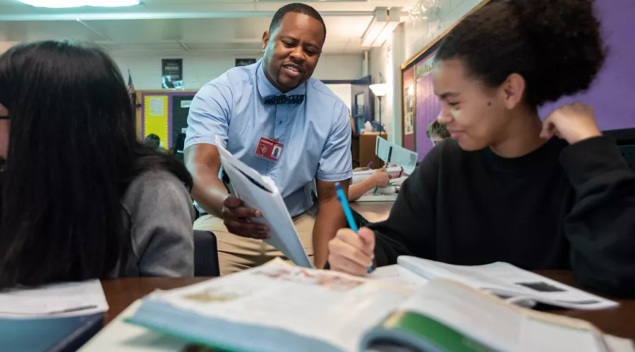 Education student working with middleschool students in the community
