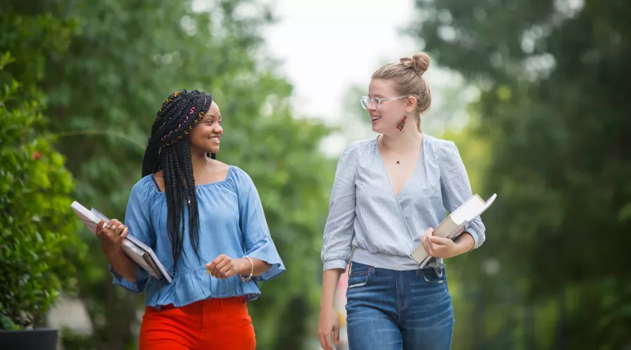 Two students walking on the Belknap campus